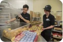 Employees happily working in the kitchen